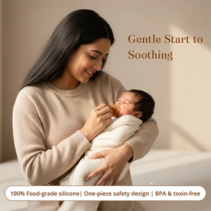 A woman in a beige ribbed sweater holds a swaddled newborn baby while offering a Sneh Dulaar Baby Pacifier. The scene is softly lit with warm neutral tones and includes the text 'Gentle Start to Soothing' and '100% Food-grade silicone | One-piece safety design | BPA & toxin-free'.