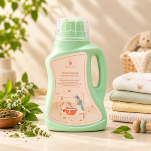 Mridul Poshaak - Liquid Wash for Baby’s Clothes, styled on a warm beige surface with baby clothes, green leaves, and a wooden bowl of herbs.