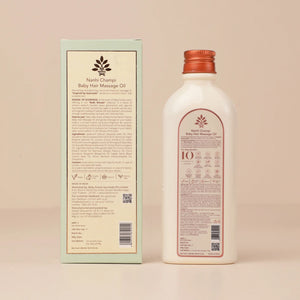 Nanhi Champi Baby hair oil bottle and packaging on a beige background