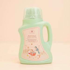 A 1L bottle of Mridul Poshaak - Liquid Wash for Baby’s Clothes in a light mint green color, featuring a translucent cap and a pink label.