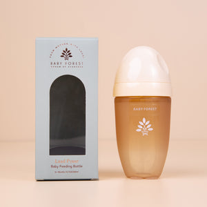 Laad Pyaar Baby Feeding Bottle with its  packaging (front side) on a beige background.