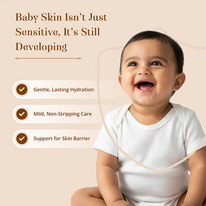A smiling baby on a beige background with promotional text about baby skin care. The text reads, 'Baby Skin Isn’t Just Sensitive, It’s Still Developing' and lists three benefits: Gentle, Lasting Hydration; Mild, Non-Stripping Care; Support for Skin Barrier with Narial Tailam- Organic Cold Pressed Coconut Oil