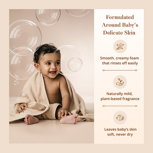 A baby wrapped in a beige towel sits on a beige floor with floating clear bubbles in the background. Text on the right reads: 'Formulated Around Baby's Delicate Skin' with bullet points about smooth creamy foam, naturally mild fragrance, and soft skin after rinsing. 